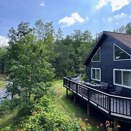 Serene Retreat On A Stream